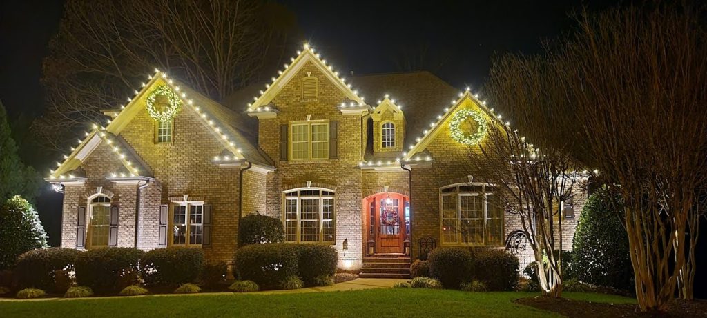 Warm white Christmas light installation on a Virginia home