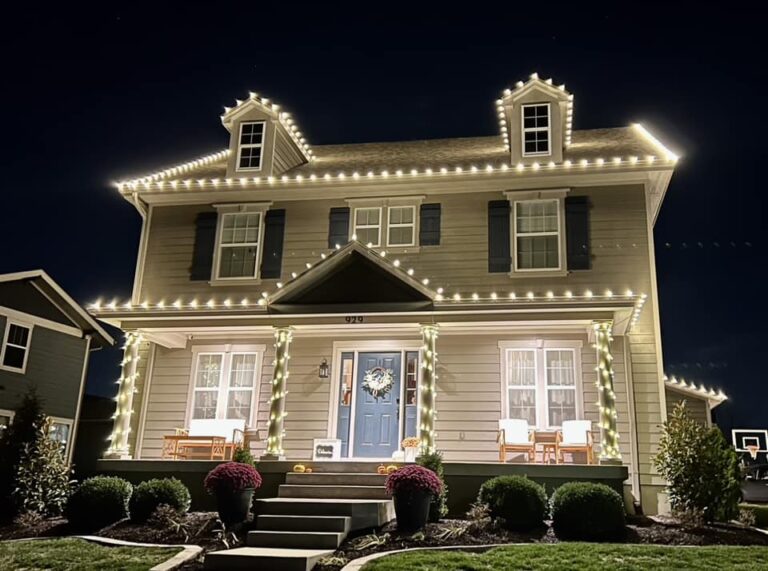 Warm white pillar and roofline Christmas lights on a Virginia home