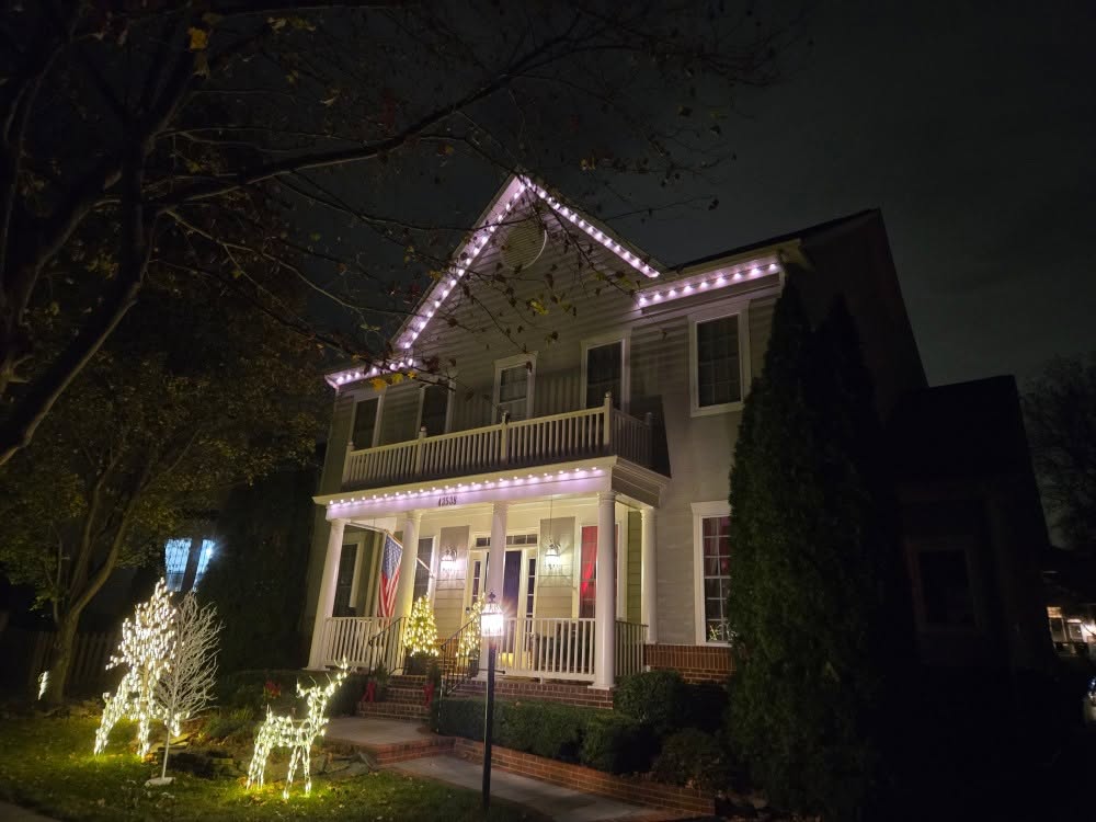 Gable, porch and roofline holiday lights with lit reindeer on an Arlington, VA home